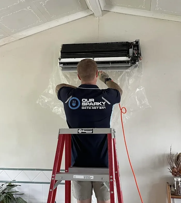 Our Sparky electrician installing a split system air conditioner in a Hervey Bay home