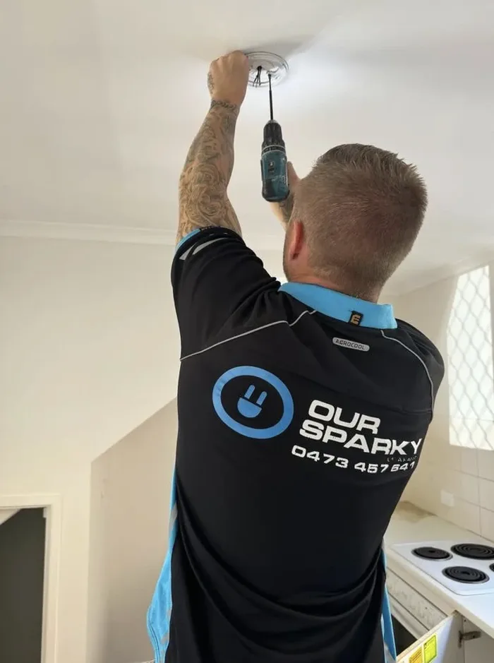 Our Sparky electrician installing a ceiling fan and light in a Hervey Bay home