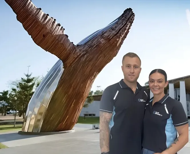 Alex and Teneka, licensed Hervey Bay electricians from Our Sparky, with the company service van